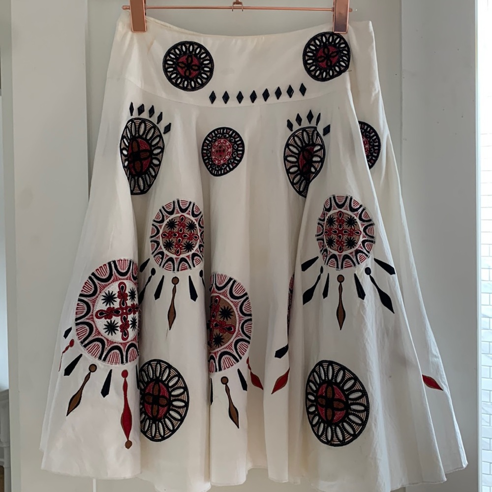 Mid length white lined skirt embroidered And beaded